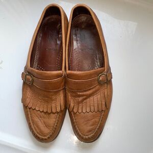 Allen Edmonds Woodville tan slip on loafers‎ with fringe & buckle